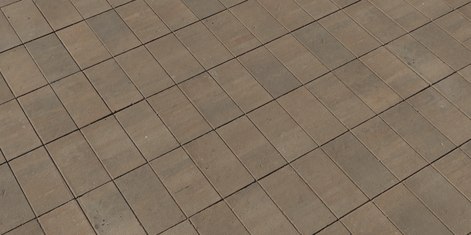 Free 8K texture of rectangular stone paving with coarse, worn surfaces, narrow grout lines and multicoloured warm brown-tan tones, subtle dirt and matte finish.