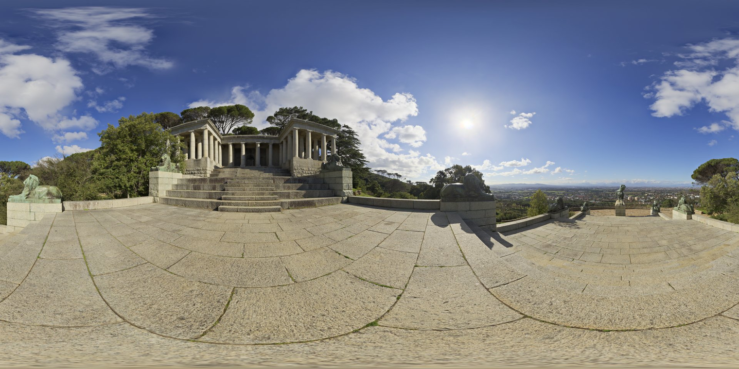 Free, unclipped 16K HDRI: bright morning sun over Rhodes Memorial - high-contrast natural light, crisp long shadows and a partly cloudy blue sky.