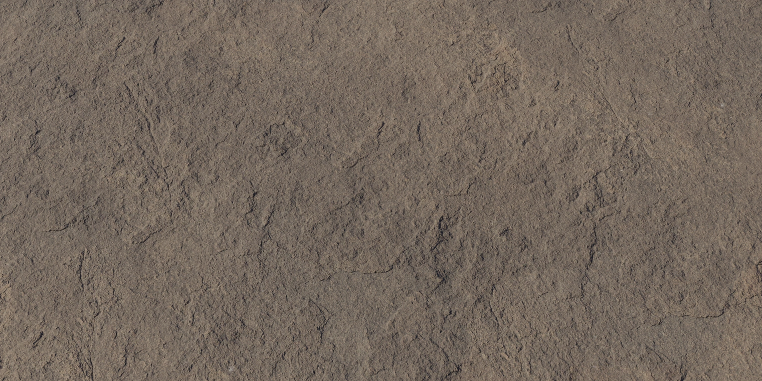 Free 16K texture of a coarse, weathered brown rock - rough, discolored and dirty stone surface with granular, eroded detail.