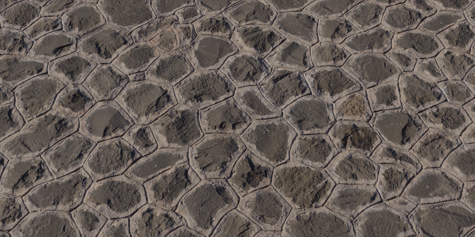 Free 16K texture: weathered stone wall with irregular polygonal joints, rough scratched faces, recessed mortar joints and subtle surface grime.