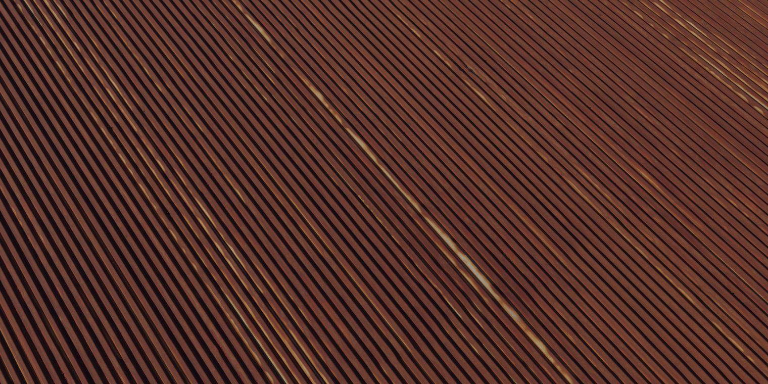 Free 8k rusty corrugated iron material with rough, weathered corrugations, deep orange-brown oxidation, streaked flaking rust and subtle pitted metal surface.