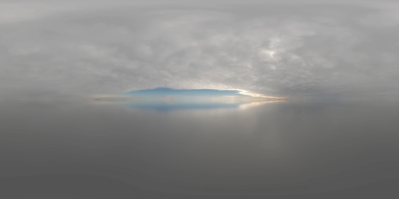 Unclipped, free 16K HDRI. Soft overcast morning light over a flat snow field with low-contrast, cool tones and a subtle sunbreak revealing a pale blue patch.