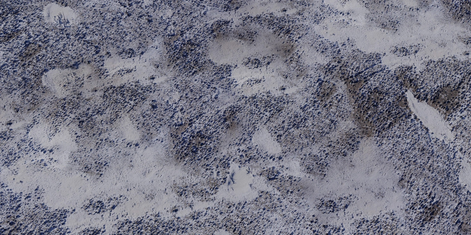 Free 8K texture of an aerial snow field: patchy white snow over dark muddy soil, granular crust, uneven terrain and natural roughness.