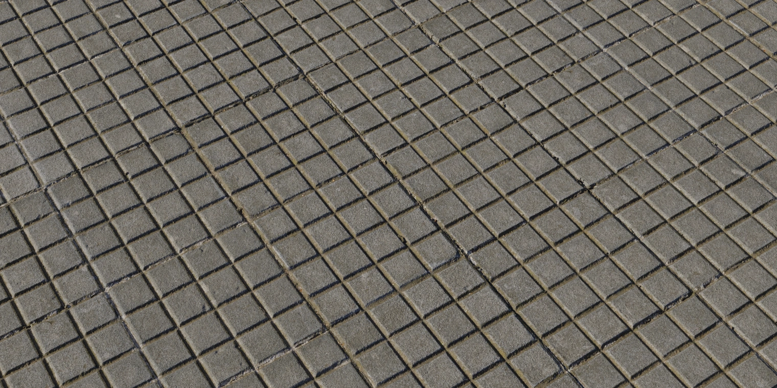 Free 8K square tile concrete floor texture. Clean, cool-gray stone tiles with narrow recessed grout, slight unevenness and subtle rough, worn details.