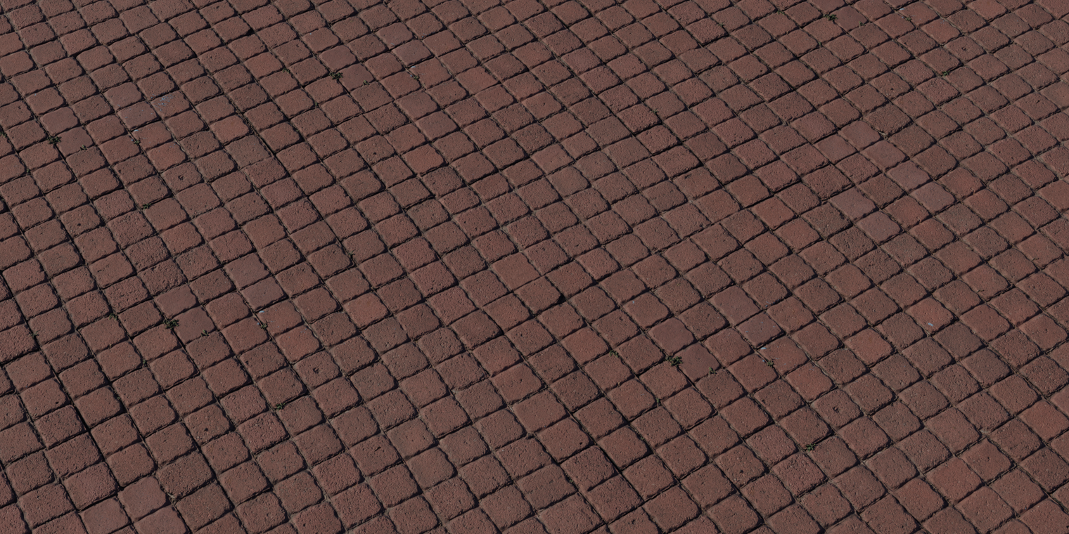 Free 8K texture of reddish-brown square pavers with rough, worn surfaces, uneven edges, and dark recessed joints.