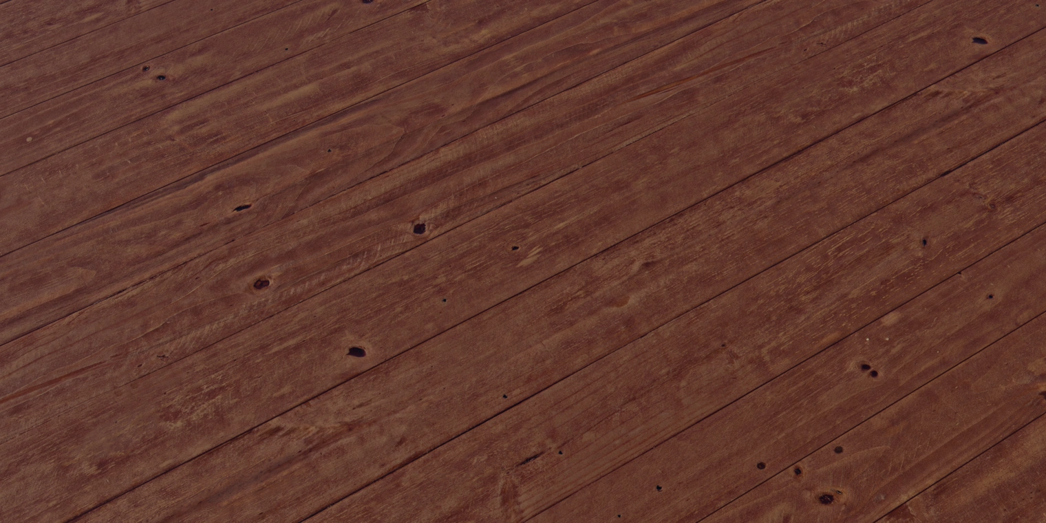 Free 16k texture of stained pine: warm brown varnished planks with visible knots, pronounced grain and seams, rough worn surface with scratches and a subtle glossy coat.