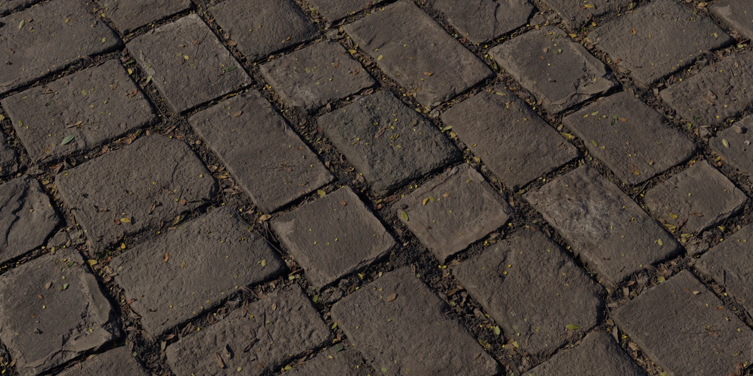Free 8k material: weathered cobblestone pathway texture with rough, uneven stones, damp sheen, worn edges and scattered fallen leaves and plant debris.