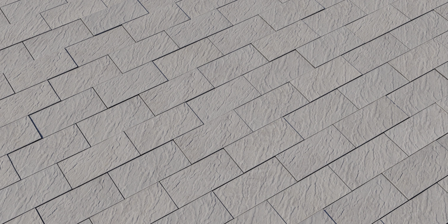 Free 8K texture of light-gray rough-hewn stone tiles with rectangular blocks, shallow mortar joints, subtle chisel marks and a matte, weathered surface.