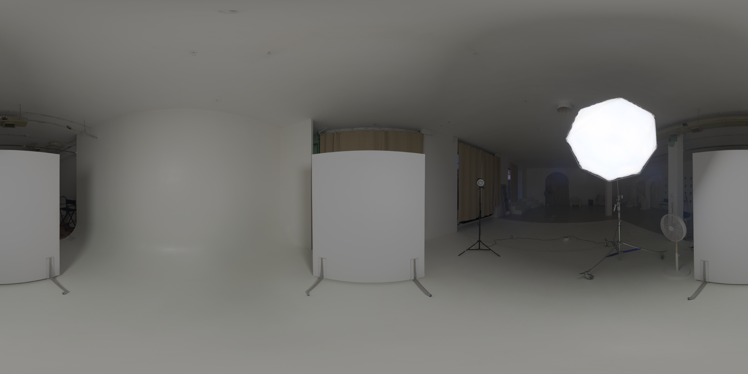 Free 20K unclipped HDRI. Soft indoor studio lighting with umbrella/softbox octabox and white infinity cove; medium contrast for portraits and product shots.