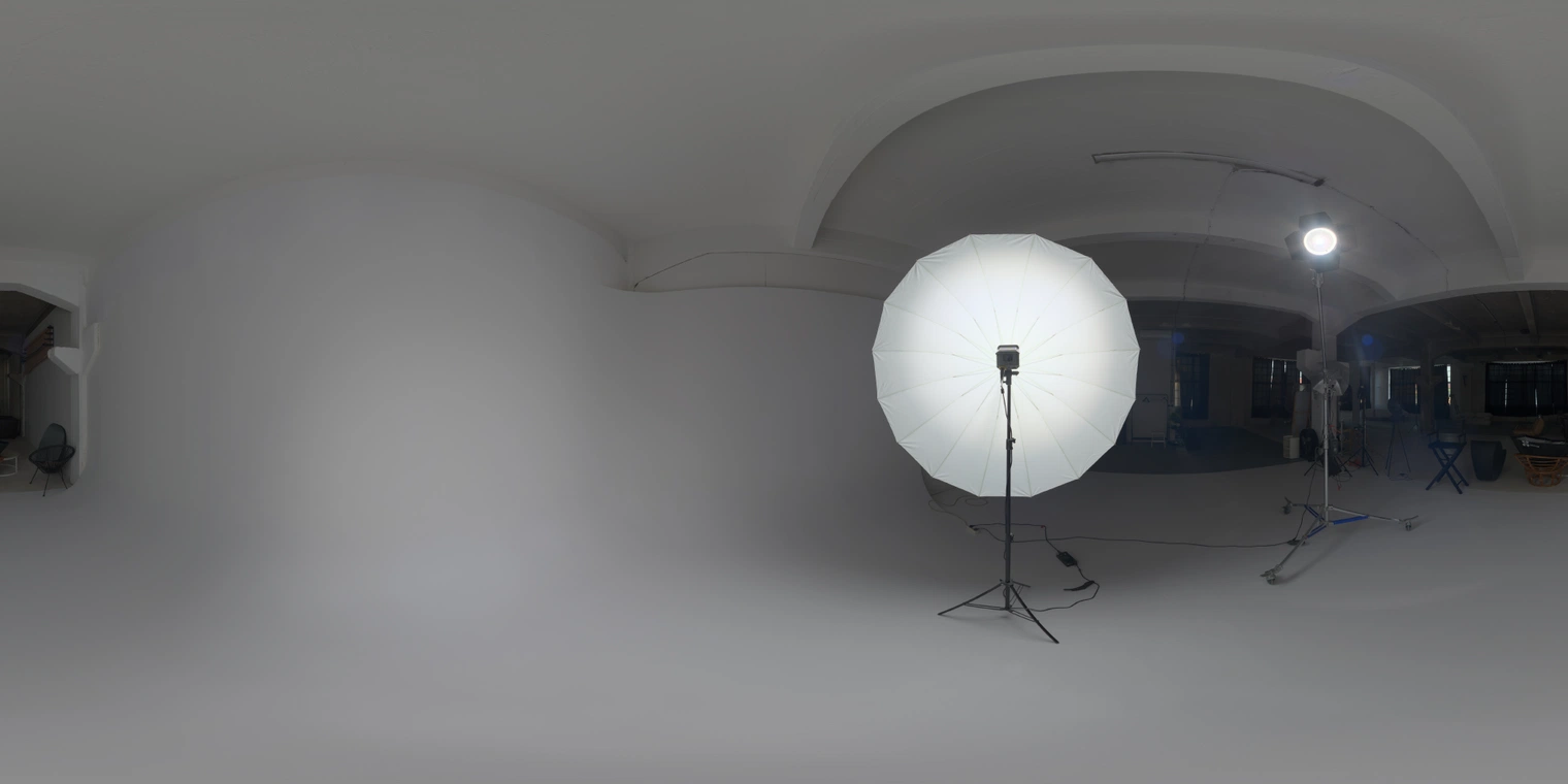 Free 20K, unclipped HDRI: umbrella key and bright lamp in an indoor studio - medium-contrast artificial lighting ideal for product, portrait, and lookdev renders.
