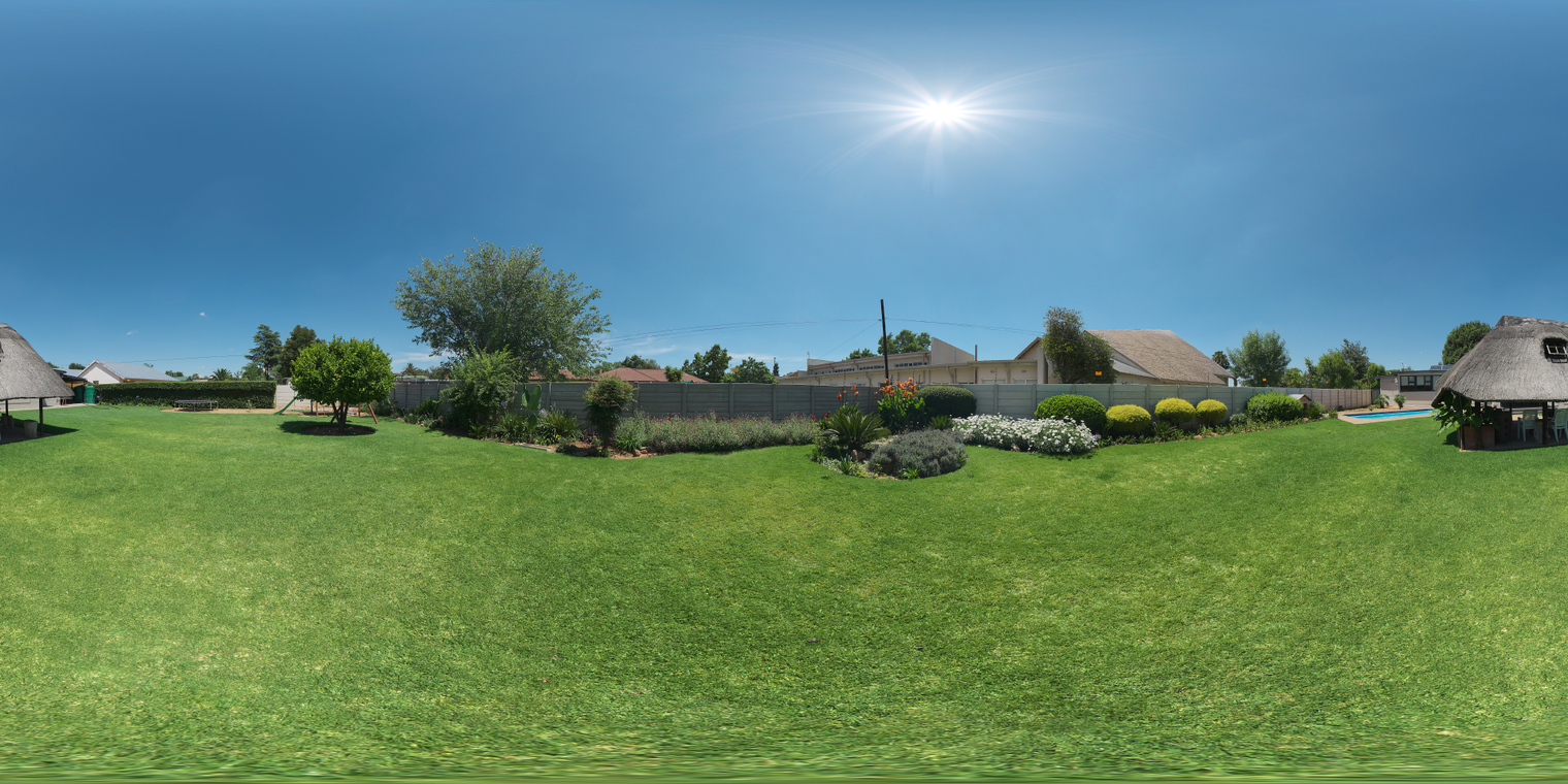 Free 20k unclipped HDRI of a sunlit residential garden - clear blue midday sky, strong direct sunlight, warm tone, crisp shadows and lush green details.