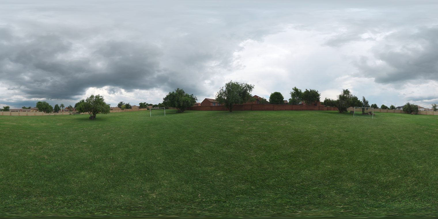 Free 20k unclipped HDRI of a suburban soccer park with heavy overcast clouds, soft diffuse light, cool tones, low-contrast shadows and even illumination.