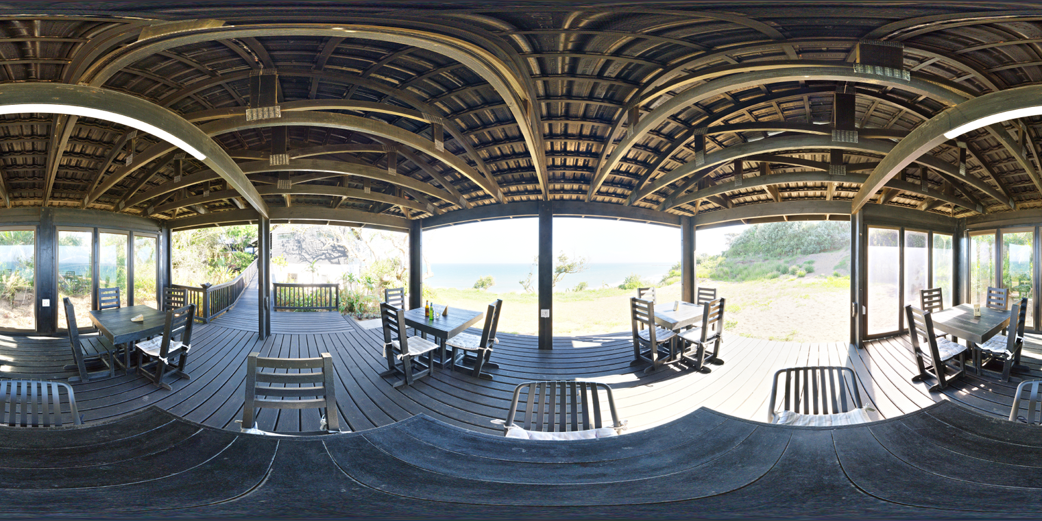 Free 24k HDRI, unclipped. Warm afternoon in a covered wooden terrace cafe on a hillside with an ocean view.