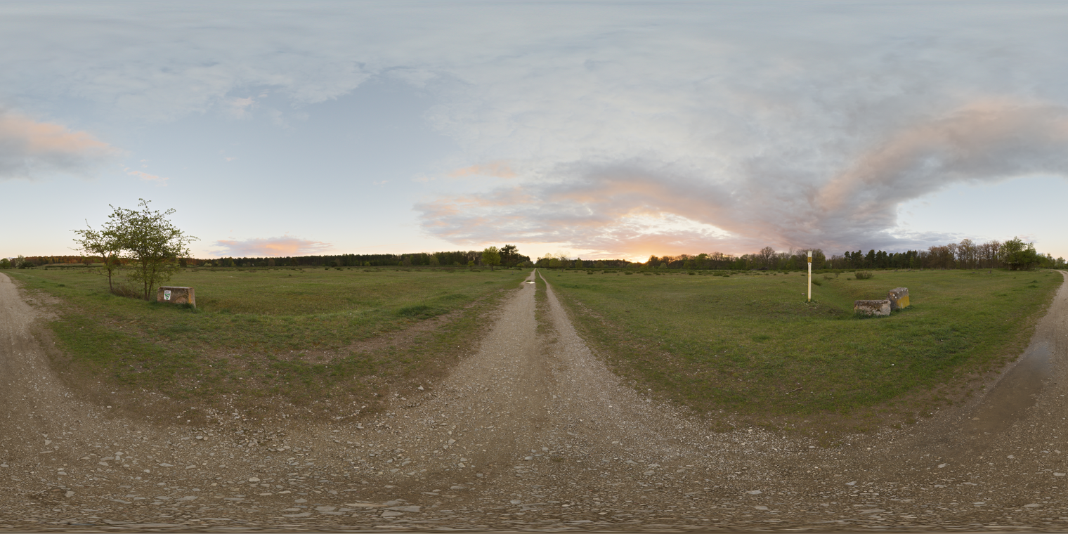 Free 24K unclipped sunset HDRI of a grassy meadow with dirt path; warm low sun, pink clouds and cool blue sky, soft shadows and gentle contrast.