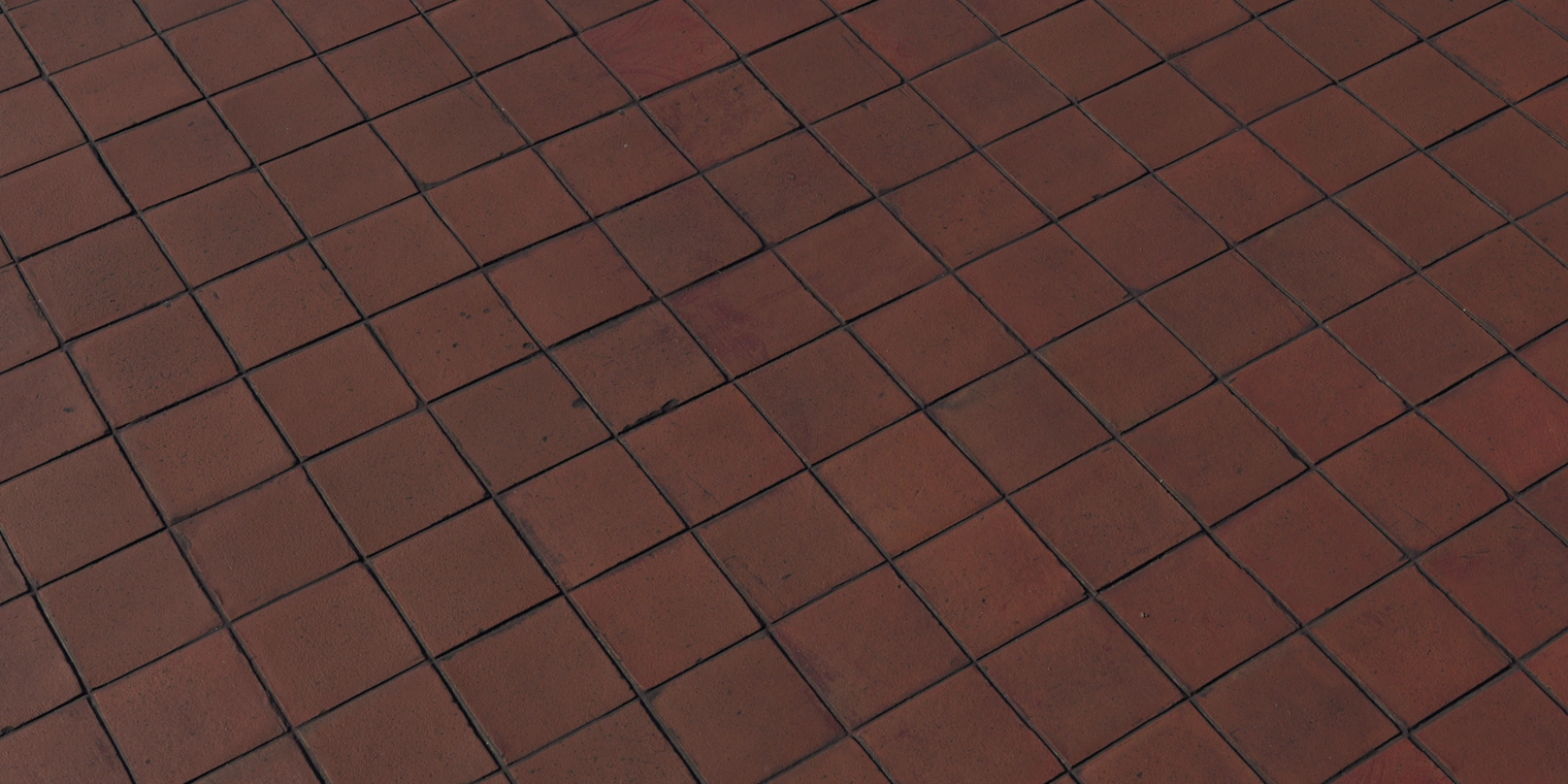 Free 8K terracotta floor tile material: warm red-brown squares with soft gloss, uneven surfaces, worn edges, and dark recessed grout lines with light stains.