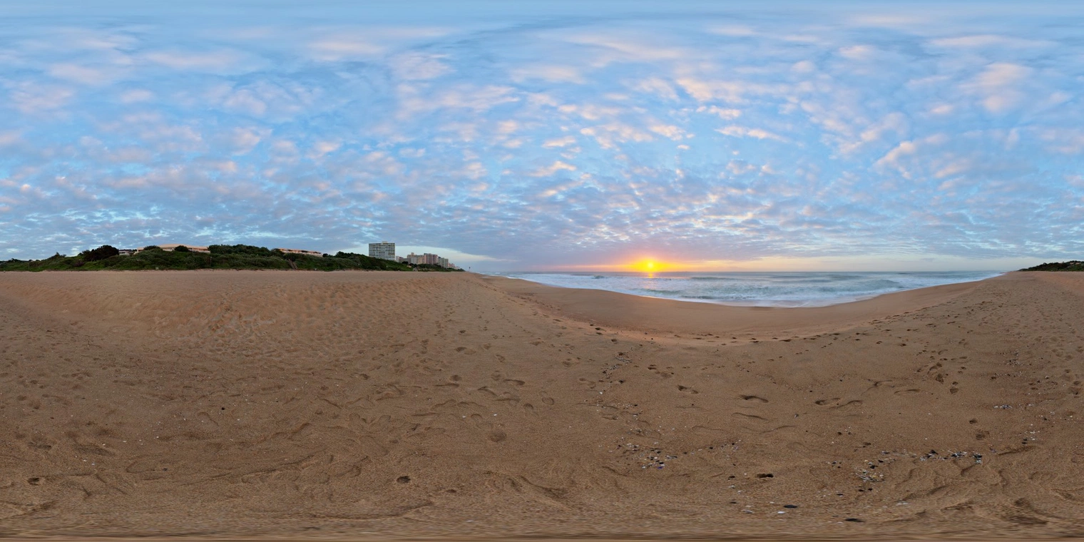 Free 16K HDRI, unclipped, soft low-contrast sunrise over a sandy beach - warm sun near the horizon, cool blue sky fill, gentle waves and scattered clouds.