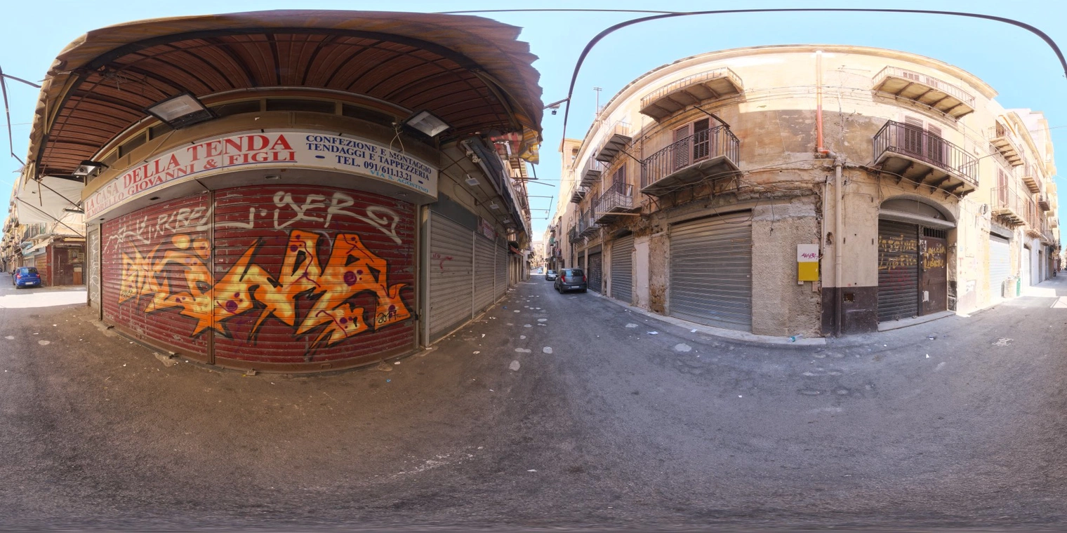 Free, unclipped 18K HDRI of a sunlit narrow European alley: clear morning light, warm tones, medium contrast, soft shadows on asphalt and weathered buildings.