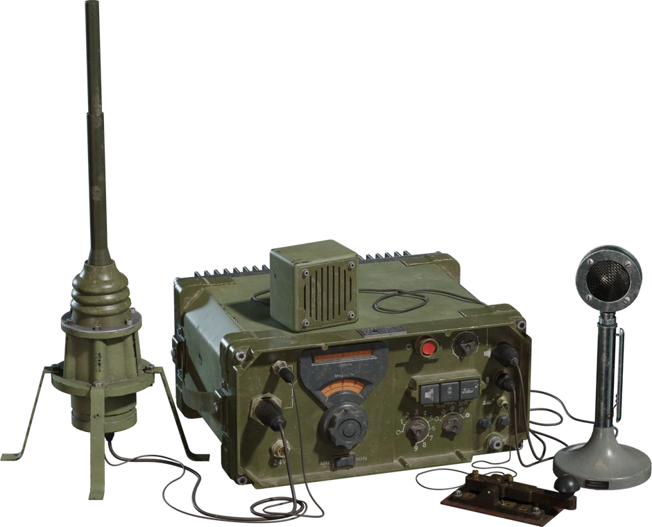 Free 4K model of a vintage military radio transceiver with weathered olive-drab case, frequency dial, cables, whip antenna, desk mic and Morse key.
