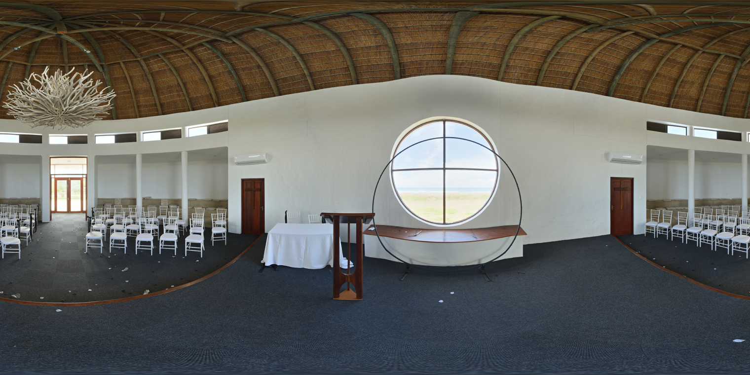 Unclipped and free 24K HDRI of a white chapel interior: soft daylight through a round window, warm thatched ceiling, neutral walls, even light, gentle shadows.