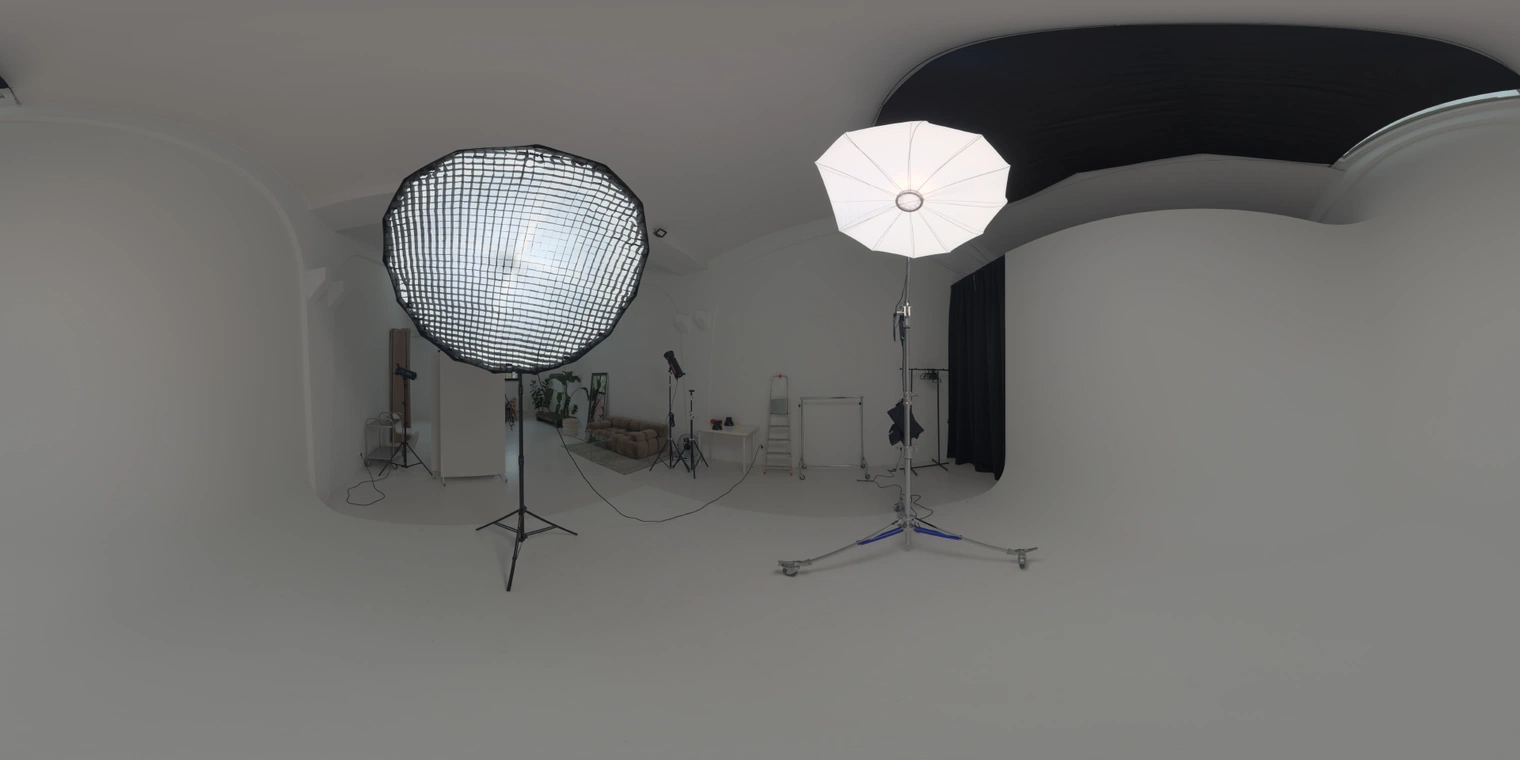 Free 20K unclipped HDRI: white studio with umbrella/grid lamps, high dark ceiling and low-contrast, even lighting. Great for portraits, product shots & lookdev.