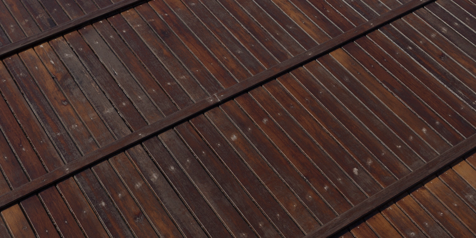 Free 16K texture of varnished dark wooden planks: narrow vertical boards, pronounced grain, nail marks, subtle wear and glossy finish.