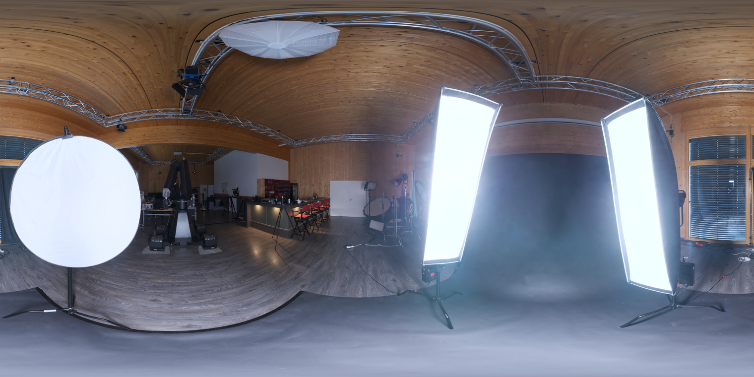 Free 24K unclipped HDRI: warm wooden studio with soft, low-contrast artificial lights, umbrellas and softboxes - ideal for portrait, product and indoor studio renders.