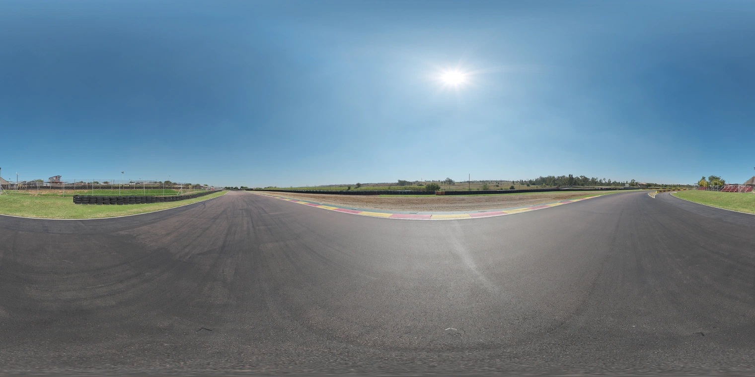 Free 20K HDRI, unclipped: bright, clear midday sun over a straight asphalt race circuit, high-contrast natural light with crisp shadows and subtle road reflections.